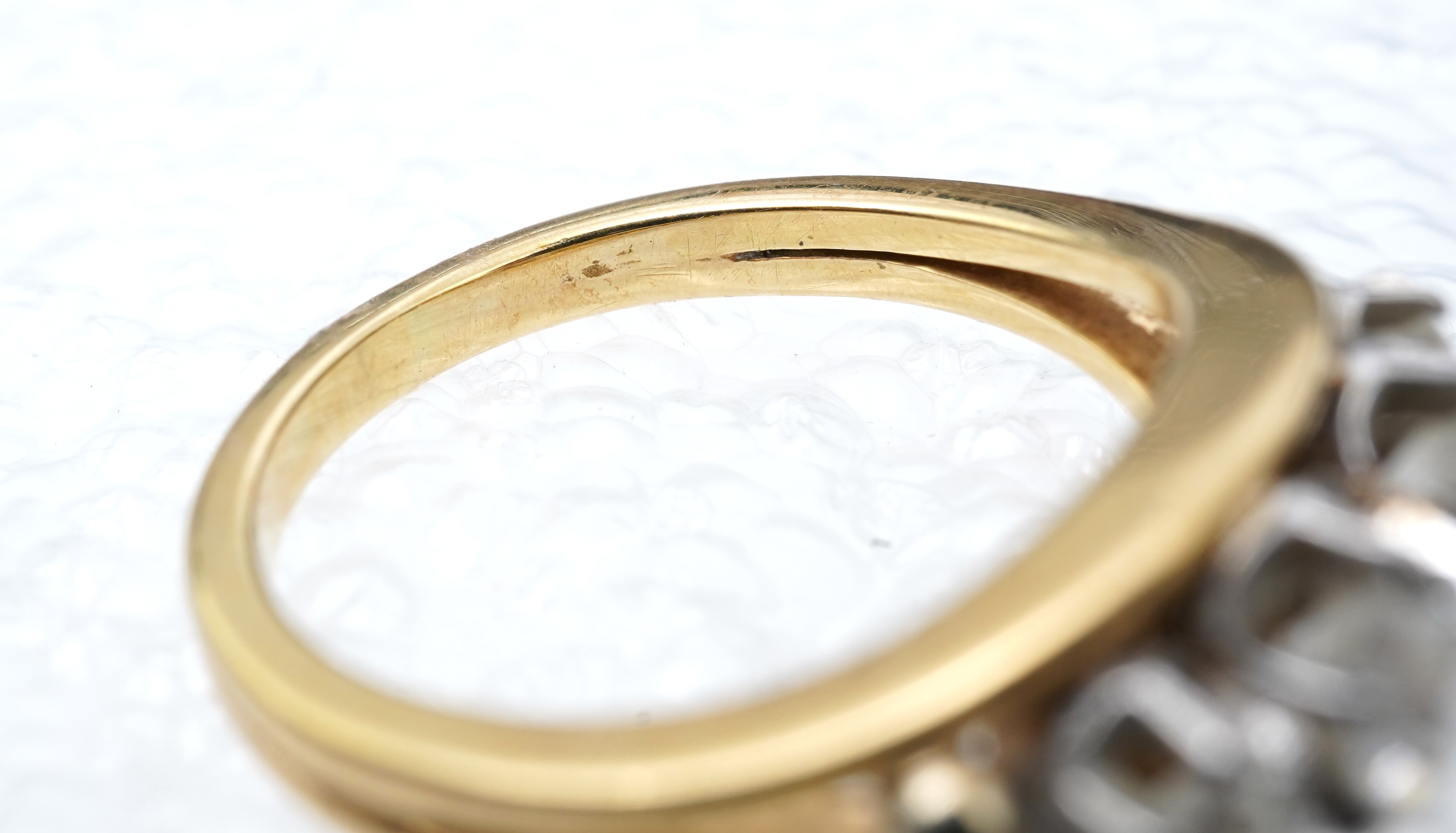 A four-stone diamond ring, mid 20th century